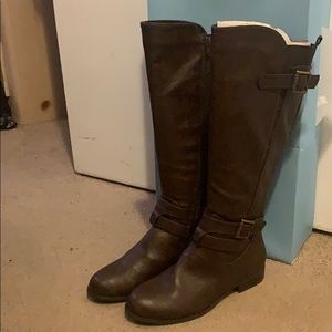 Tall brown riding boots.